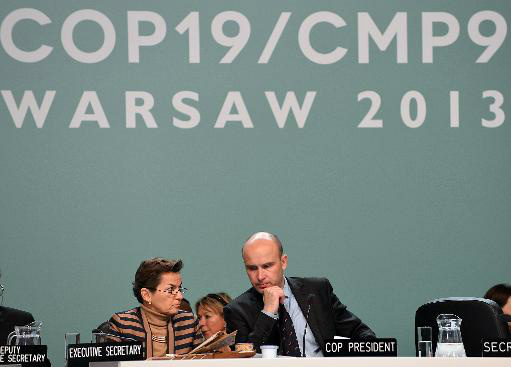 Marcin Korolec, que preside a conferência, conversa com Christiana Figueres, secretária da ONU para o clima (AFP, Janek Skarzynski)