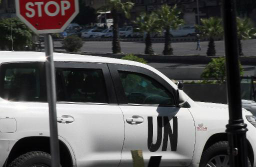 Um carro com inspetores da Organização para a Proibição das Armas Químicas (OPAQ) deixa um hotel de Damasco, em 11 de outubro de 2013 (AFP/Arquivos, Jiang Tieying)
