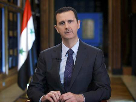 Presidente da Síria, Bashar al-Assad, fala durante entrevista com emissora de TV estatal venezuelana TeleSUR, em Damasco, 26 de setembro de 2013. 