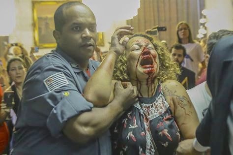 Das bombas de Dória às balas que assassinaram Marielle Franco Professora, vítima da truculência policial sob os comandos de João Dória.