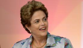 Dilma diz, em mensagem de Ano-Novo, que está "otimista" com 2016 A presidenta Dilma Rousseff disse que o Brasil é maior do que interesses individuais e de grupos